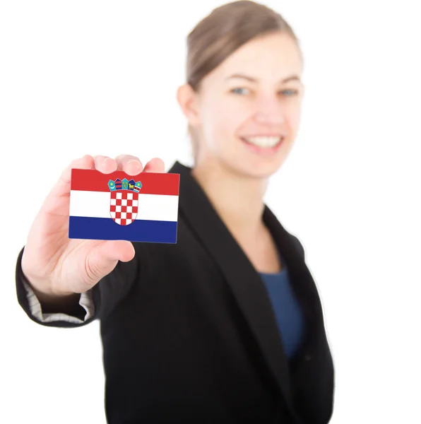 Hırvatistan bayrağı ile bir kart tutan bir iş kadını — Stok fotoğraf