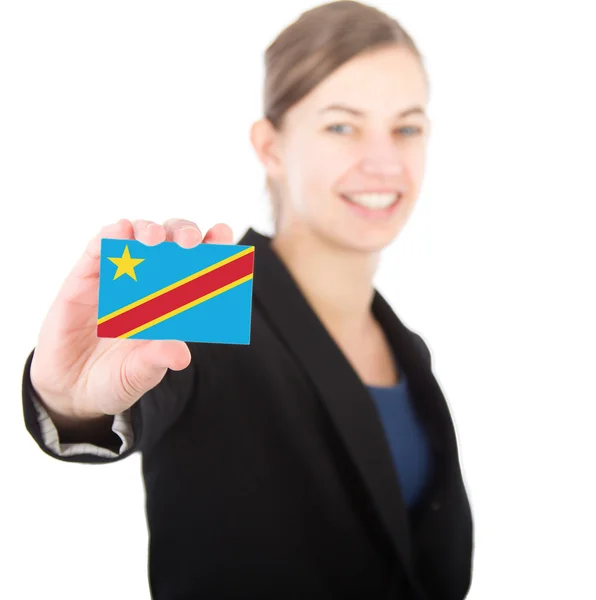 Business woman holding a card with the flag the Congo — Stock Photo, Image