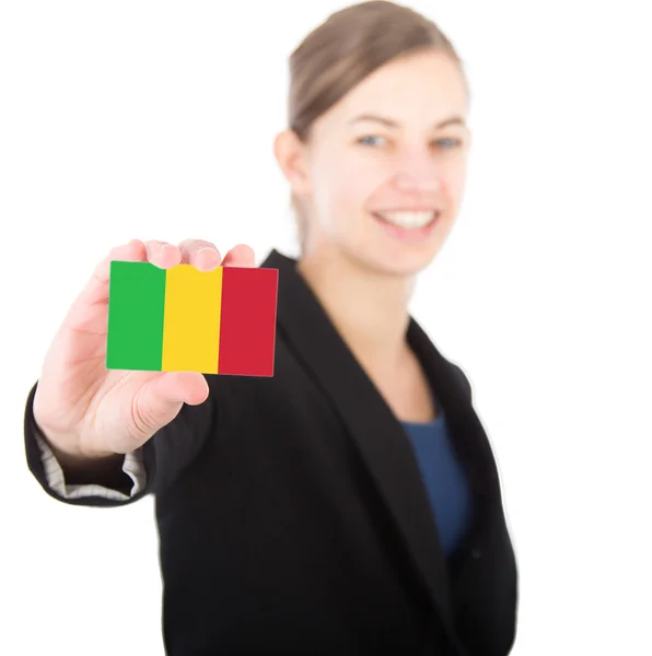 Business woman holding a card with the flag of Angola — Stock Photo, Image