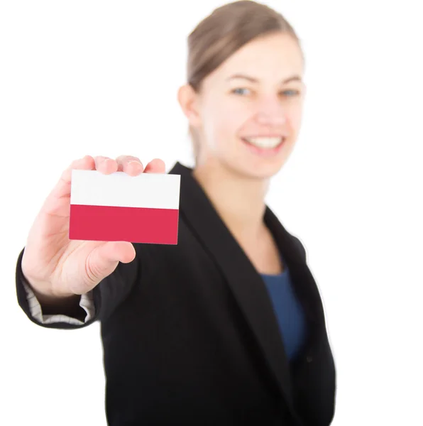 Business woman holding a card with the flag of Poland — Stock Photo, Image