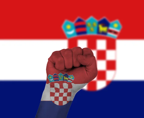 Näve insvept i Kroatien flagga — Stockfoto