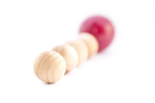 Row of balls with one different red ball. — Stock Photo, Image