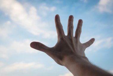 Hand reaching to sky. clipart