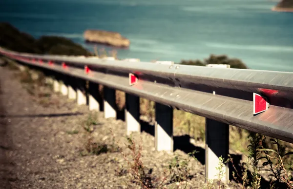 Red reflector on road. — Stock Photo, Image