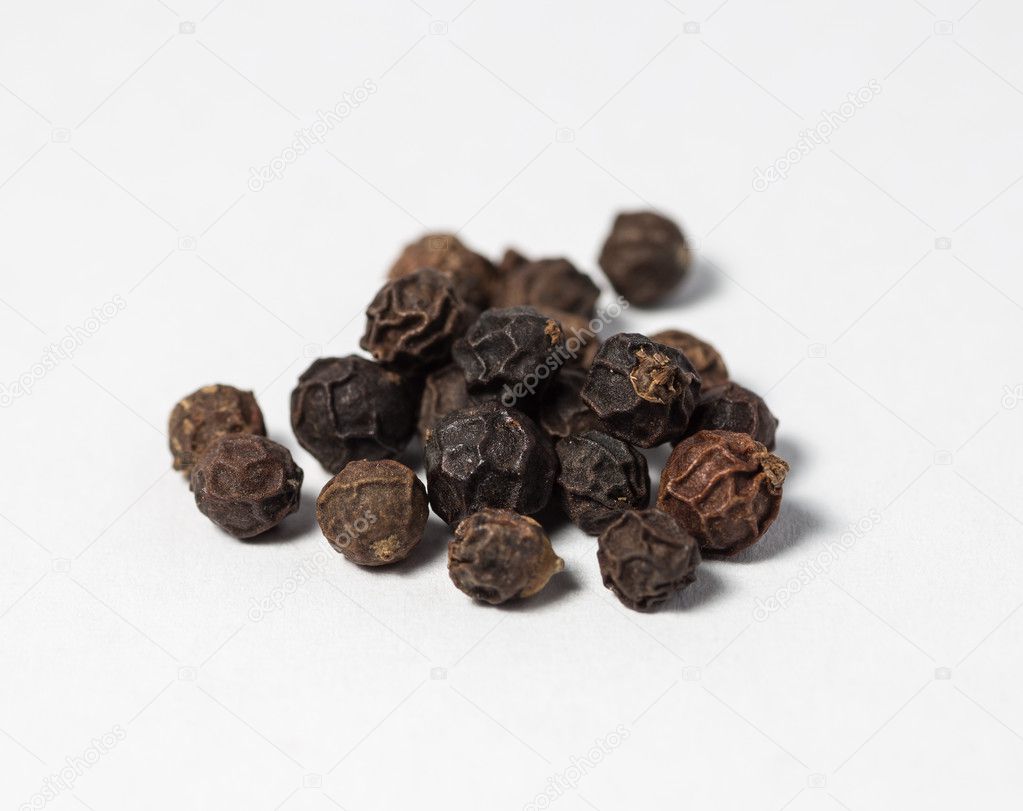 Pieces of black pepper.
