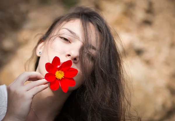 Portrait of young woman with flower. — Stock Photo, Image