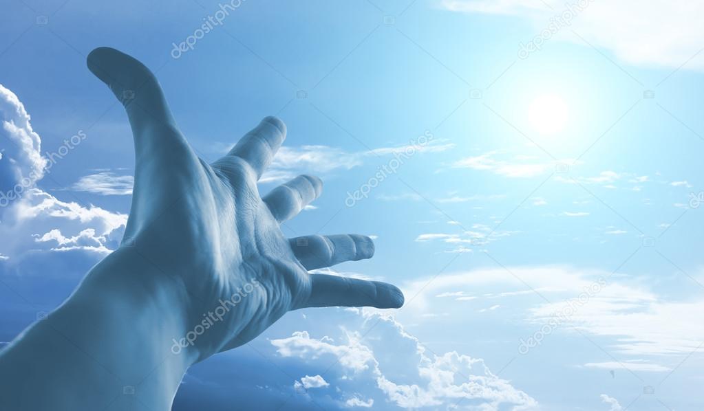 Hand reaching to sky.
