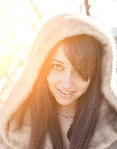 Winter girl with strong sunshine effect. Color toned image. — Stock Photo, Image