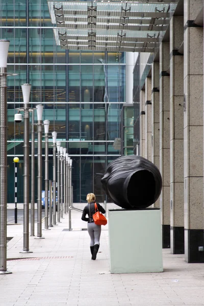 Woman in front of modern business offices center. — Stock Photo, Image