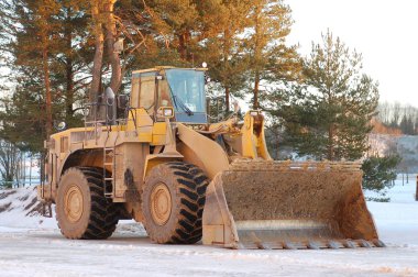 Heavy front loader in open pit