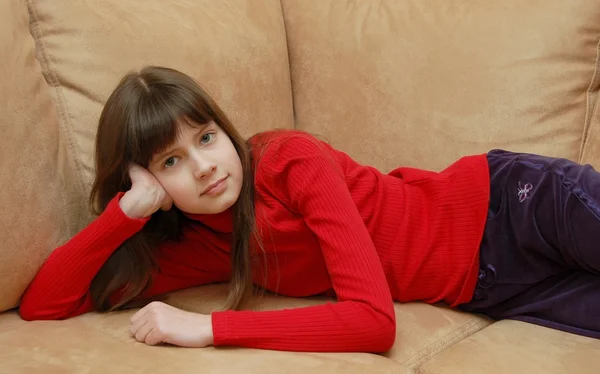 Beautiful girl on a sofa — Stock Photo, Image