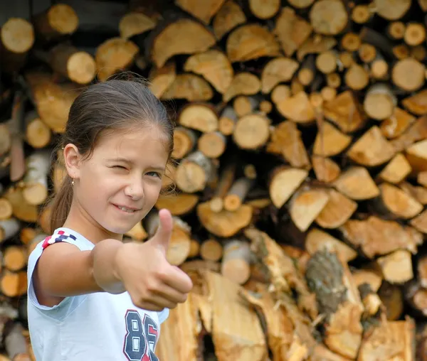 Girl shows thumb up — Stock Photo, Image