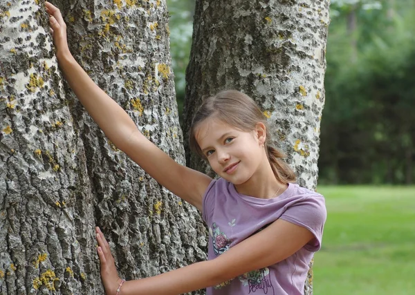 Girl by the birch tree — Stock Photo, Image