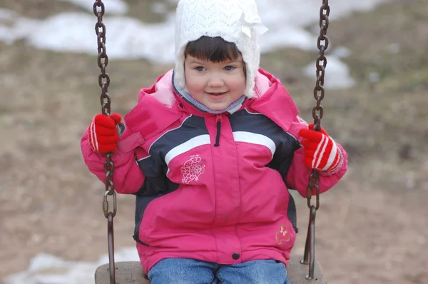 Portrait of beautiful baby girl on the swing — Stock Photo, Image