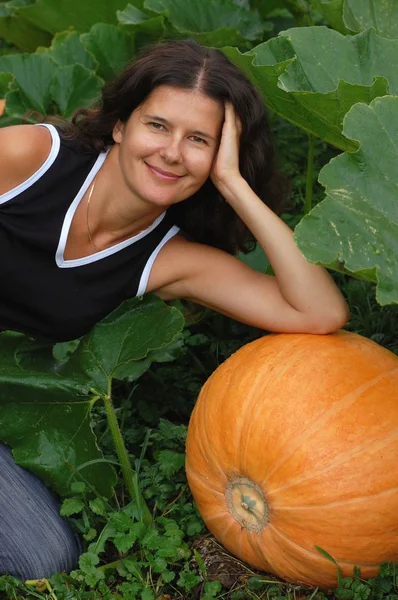 Woman with pumpkin — Stock Photo, Image