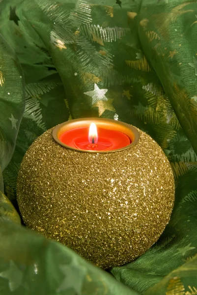 Christmas Candle on Shiny Fabric with Glowing Stars — Stock Photo, Image