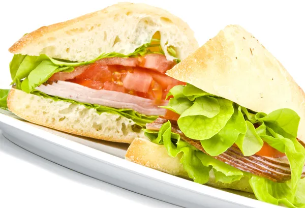 Focaccia sandwich på vit platta — Stockfoto