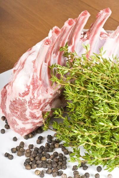 Rack of Raw Lamb with Thyme and Black Peppercorn — Stock Photo, Image