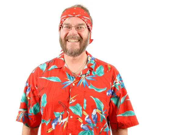 Χαμογελαστός άνθρωπος σε ένα πολύχρωμο πουκάμισο — Φωτογραφία Αρχείου