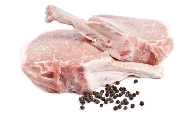 두 개의 원시 Frenched 돼지고기와 검은 후추 흰색 절연 — 스톡 사진