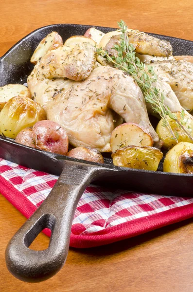 Roasted Cornish Game Hen and Potatoes Garnished with Sprig of Thyme — Stock Photo, Image