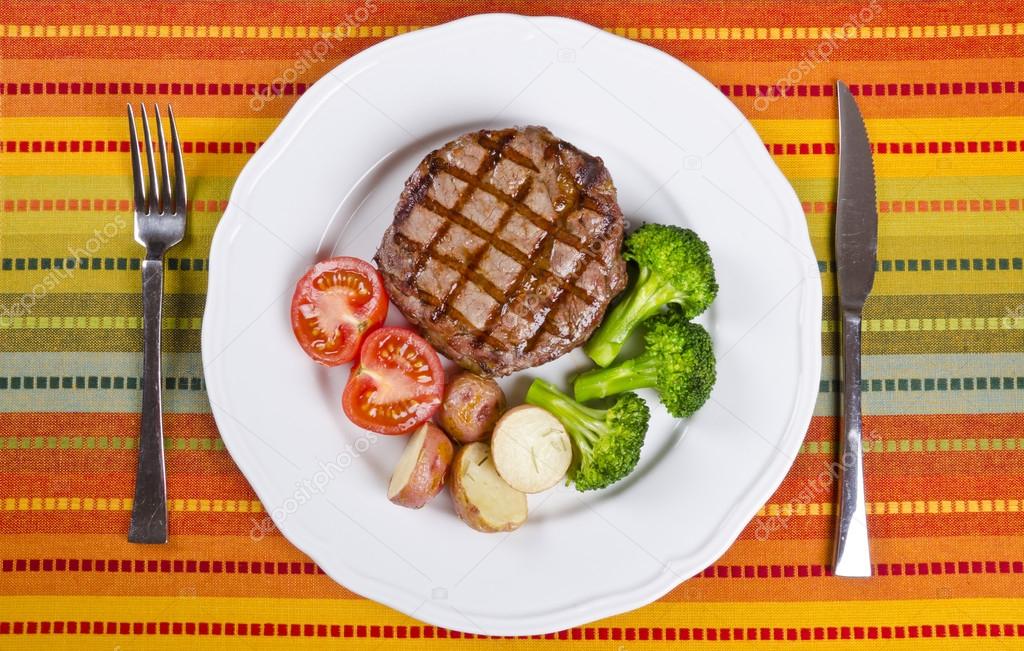 Barbecued Rib Eye Steak Served with Broccoli, Potatoes and Tomatoes