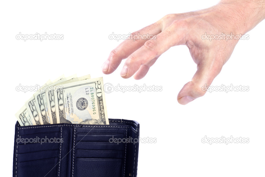 Hand Reaching for Twenty US Dollar Bills