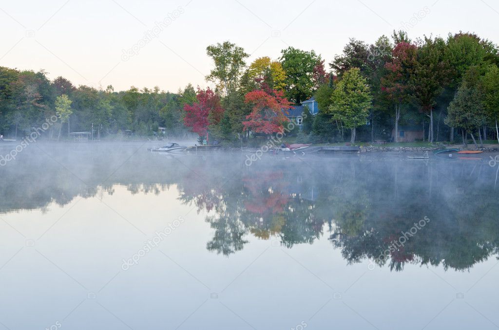 Reflections of Fall Colors and Clouds on a Lake