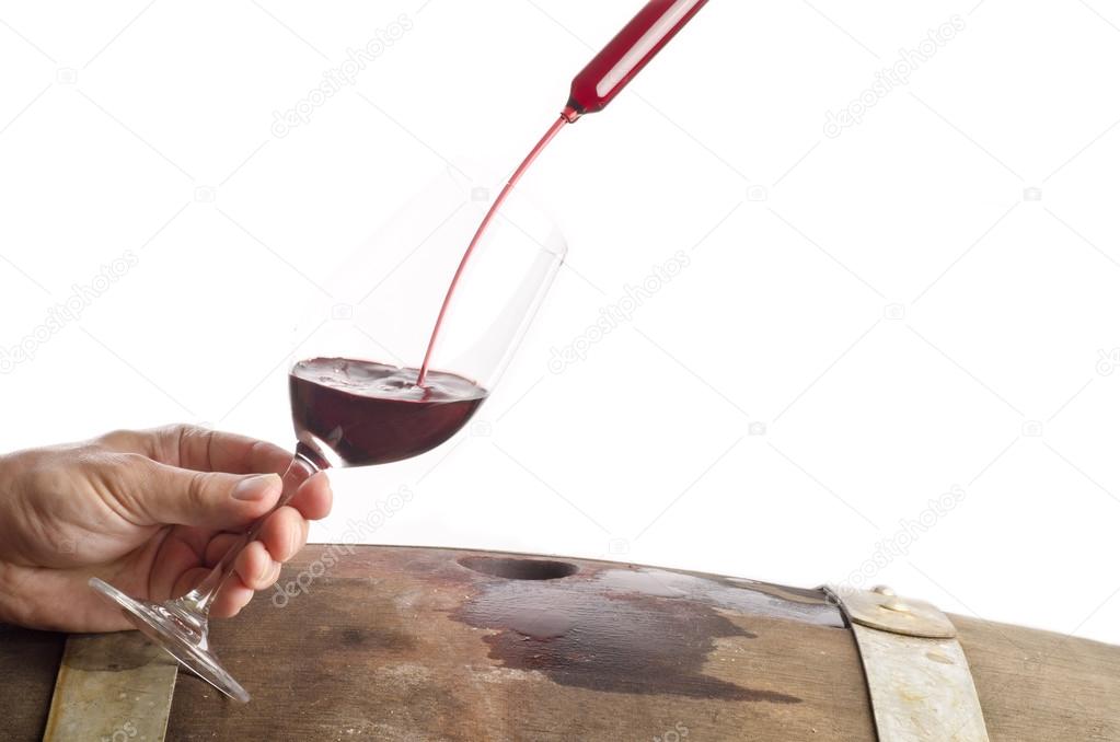 Tasting Red Wine from a Barrel