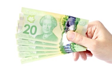 Hand Holding Canadian Money clipart