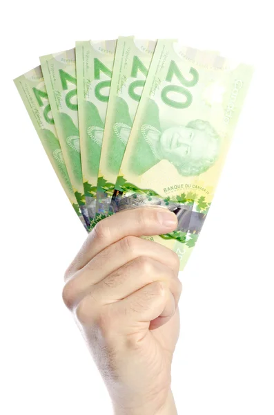 Mano sosteniendo dinero canadiense — Foto de Stock