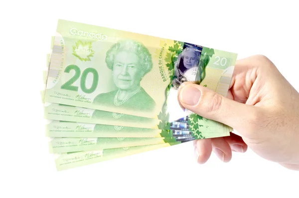 Mano sosteniendo dinero canadiense — Foto de Stock