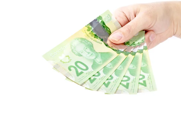 Mano sosteniendo dinero canadiense — Foto de Stock