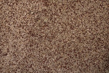 Çocuk parkının zemininde kumlu bir dokunun fotoğrafı. Açık hava dokusu ve duvar kağıdı. Lastik döşeme