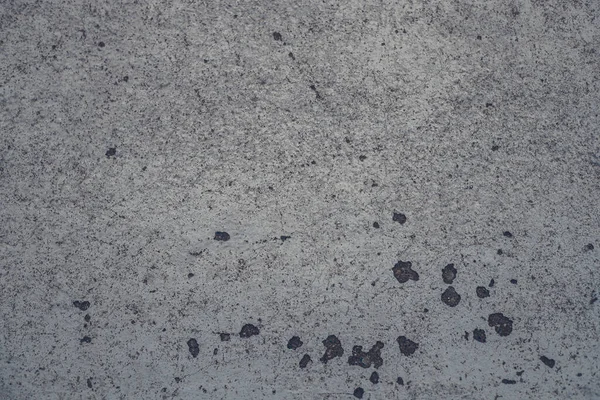 Paslı ve soyut beton yüzey dokusunun fotoğrafı. Beton yüzey, beton, taş, çizikler. Grunge Biçimi