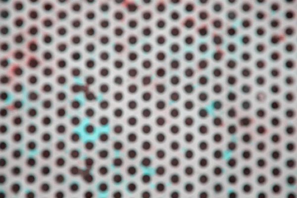 Geometrik ızgara şeklinde metalik bir yüzeyin fotoğrafı. Bulanık effec ile metal paslı yüzey