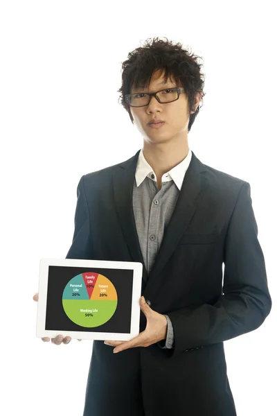 Asian business man holds tablet computer — Stock Photo, Image