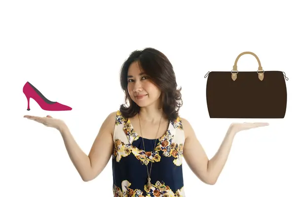 Žena ukazuje obraz boty a tašky — Stock fotografie
