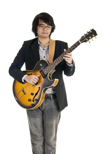 Asiatisk ung musiker spiller guitar - Stock-foto