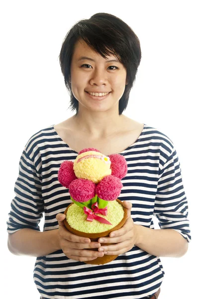 Smiling girl holding flower — Stock Photo, Image