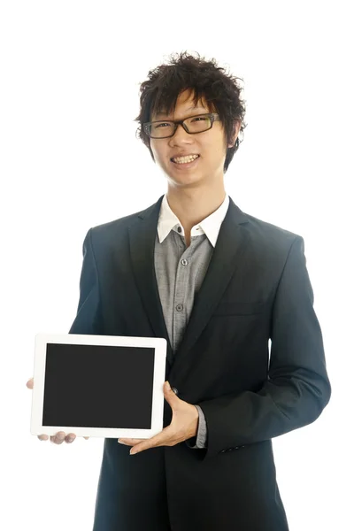 Asian business man holds tablet computer — Stock Photo, Image