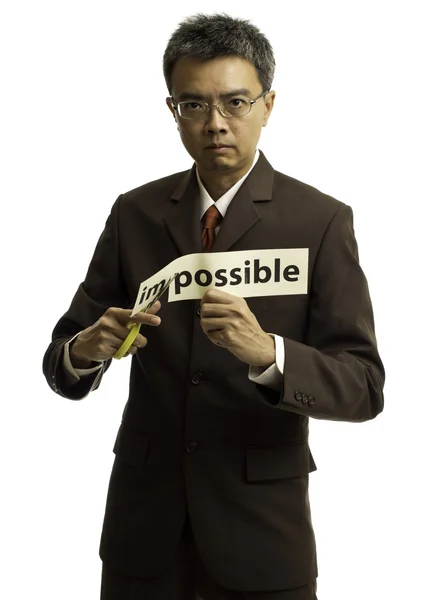 Ασιατικές επιχειρηματίας Κόψτε το χαρτί για την λέξη δυνατό — Φωτογραφία Αρχείου
