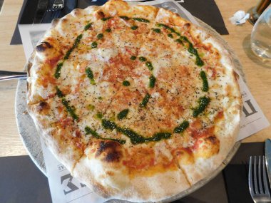 Pizza margherita served in a restaurant in Athens, Greece