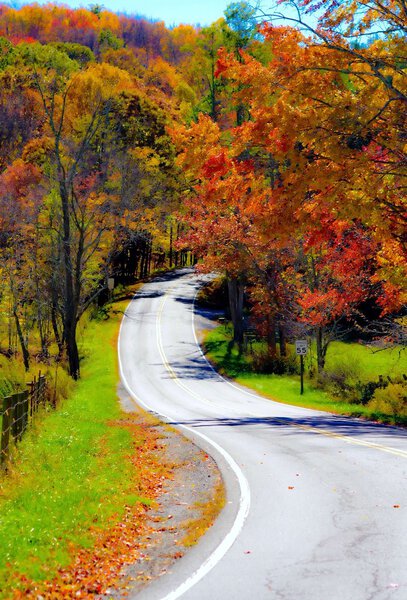 Winding rural mountain road in Autumn