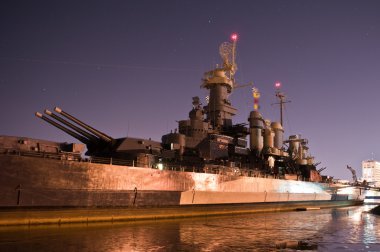 USS North Carolina arsenal at night clipart