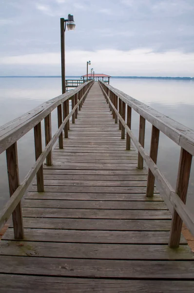 Boardwalk over water at dawn — Stock Photo, Image