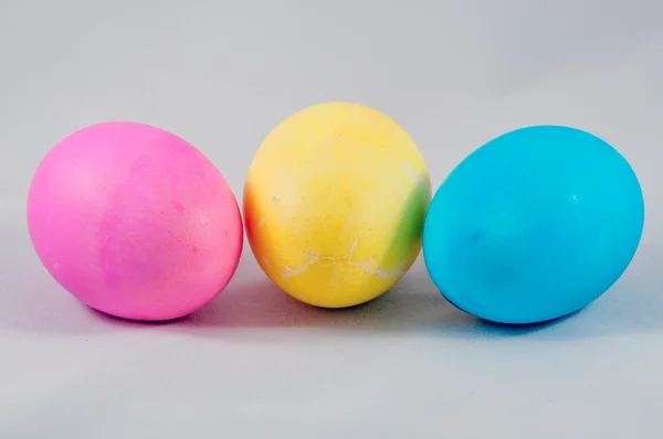 Three easter eggs pink blue yellow — Stock Photo, Image