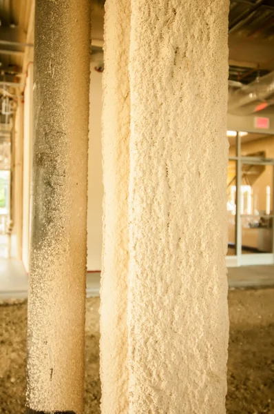 Sprayed on fireproofing on a steel building column — Stock Photo, Image