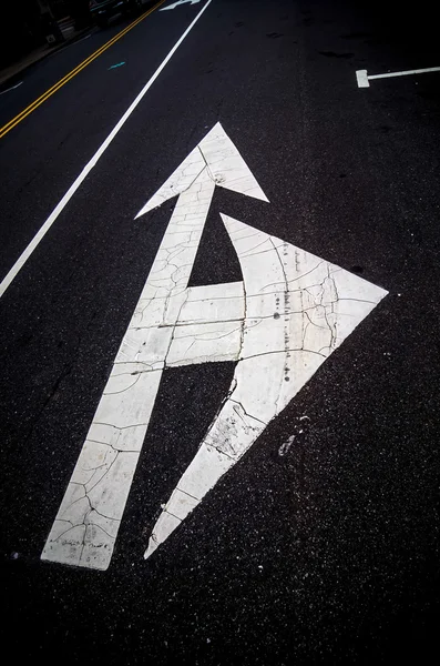 Painted direction arrow on pavement — Stock Photo, Image