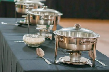 banquet table with chafing dish heaters clipart